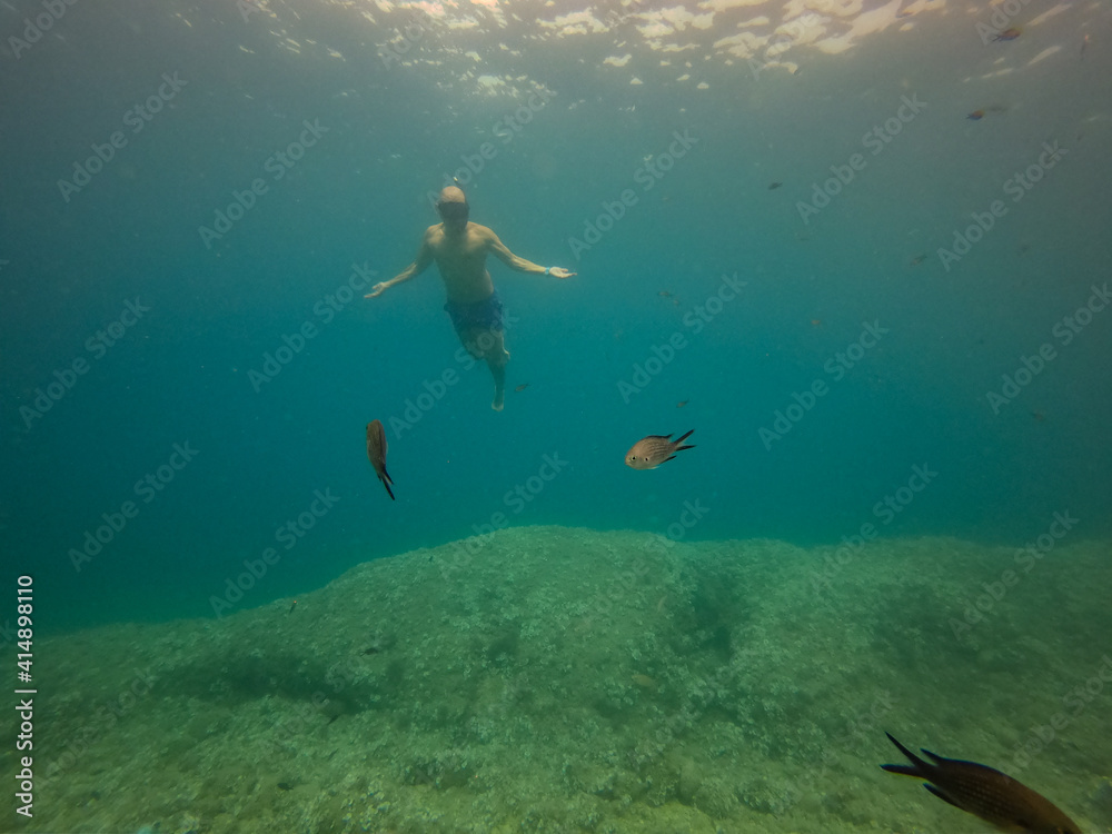  underwater man snorkeling in the sea with crystal-clear waters concept of holiday relax summer beach diver in the sea