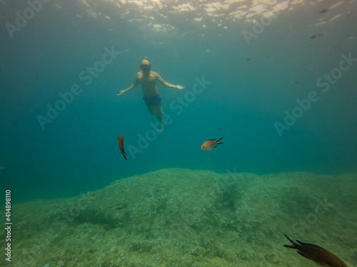 underwater man snorkeling in the sea with crystal-clear waters concept of holiday relax summer beach diver in the sea