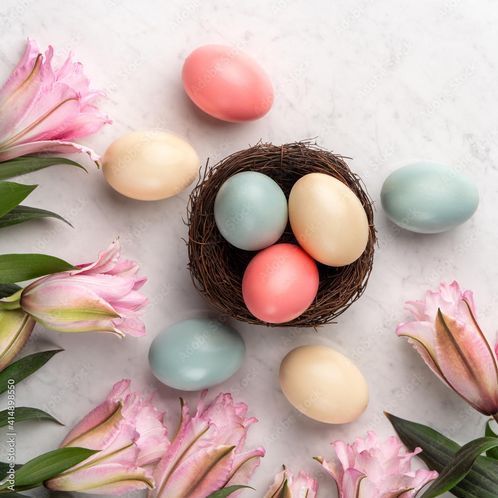 Colorful Easter eggs in the nest with pink Double Lily flower. Colorful Easter eggs in the nest with pink Double Lily flower.