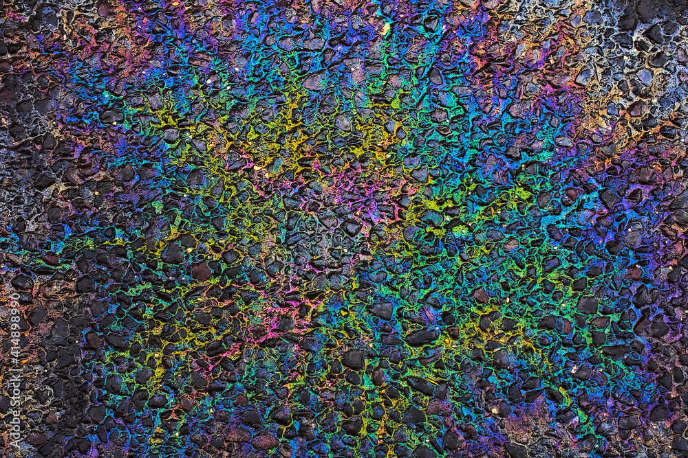 Beautiful colorful abstract picture for background, wallpaper or decoration : rainbow oil spill on asphalt; color photo.