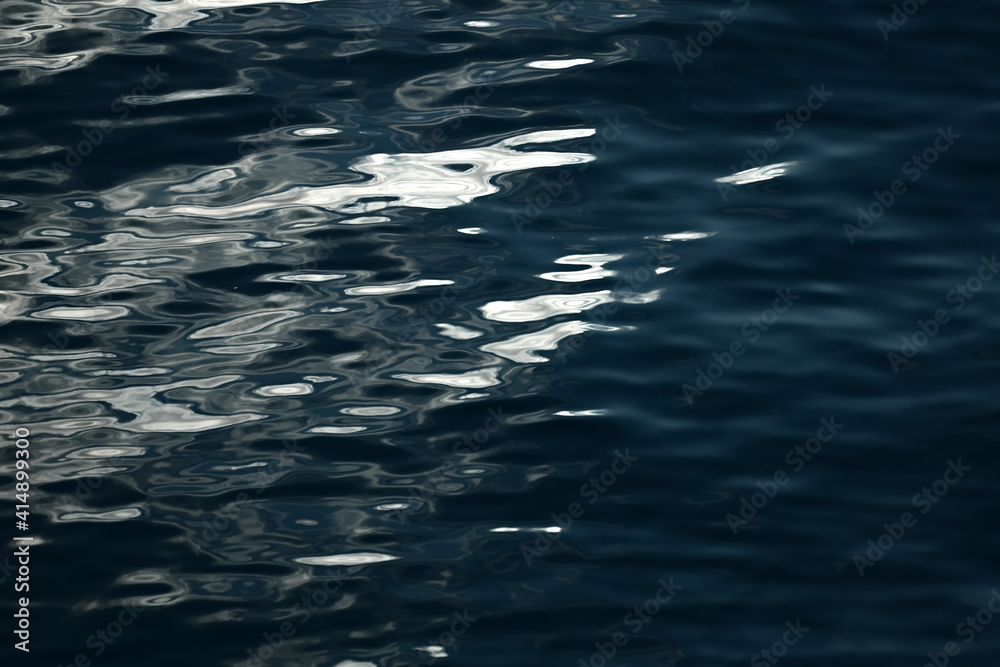 Rippling dark sea water surface with sunlight reflection in Croatia, Europe. Color photo, background. Rippling dark sea water surface with sunlight reflection in Croatia, Europe. Color photo, background.
