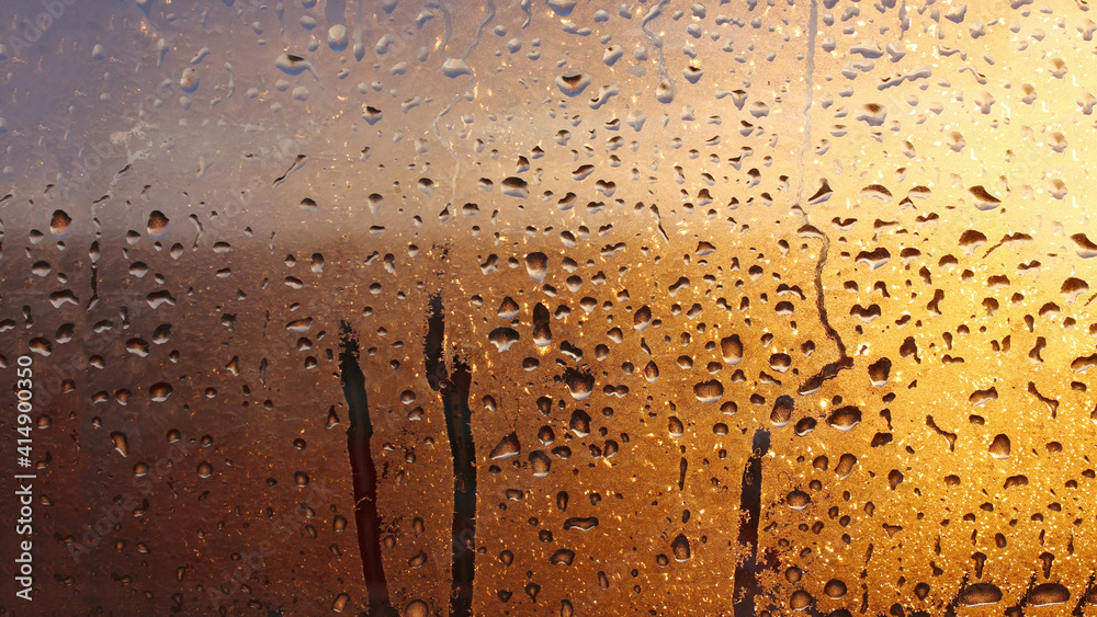 Drops condensation on the clear glass window. Water drops. Abstract background texture, condensation on the glass with dripping drops