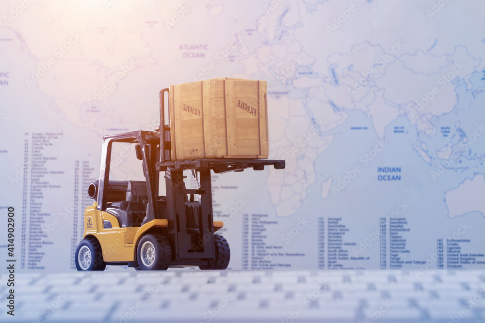 Forklift truck handling cargo shipping container box with worldmap background use as online tracking technology of worldwide logistic, shipping, import and export concept. Forklift truck handling cargo shipping container box with worldmap background use as online tracking technology of worldwide logistic, shipping, import and export concept.