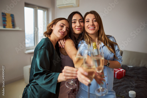 Women celebrating their get-together with sparkling wine
