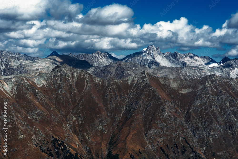 Stunning view of the mountain gorge. Mountain landscape. Beautiful view of the snow-capped mountain peaks. Panoramic view of the glacier. The Caucasus mountain range. Beautiful scenery. Copy space