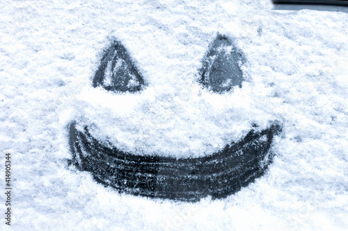 image on the snow-covered surface of the car window