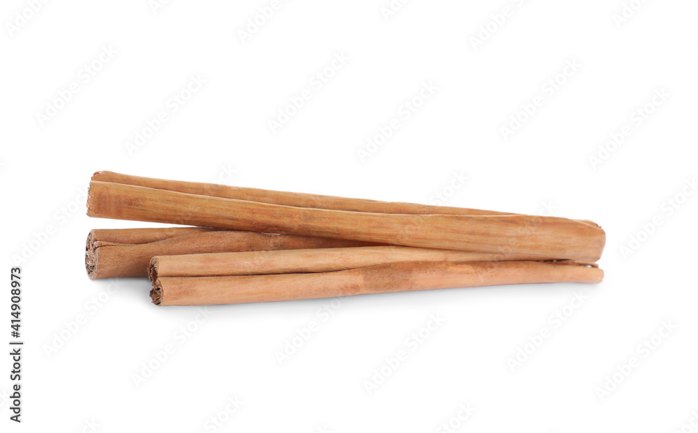 Aromatic brown cinnamon sticks on white background