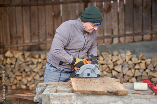 Carpenter using circular saw