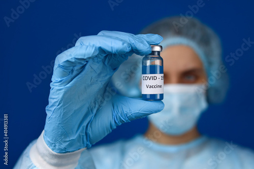 medical scientist holding Coronavirus COVID-19 DNA vaccine. Selective focus