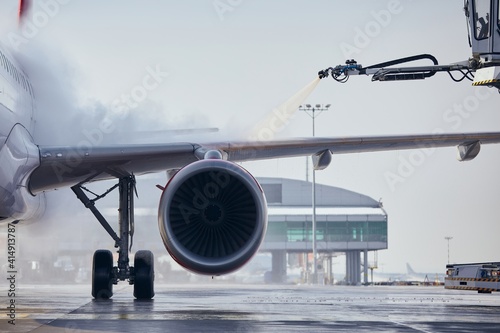 Photos Deicing of aircraft wing before flight