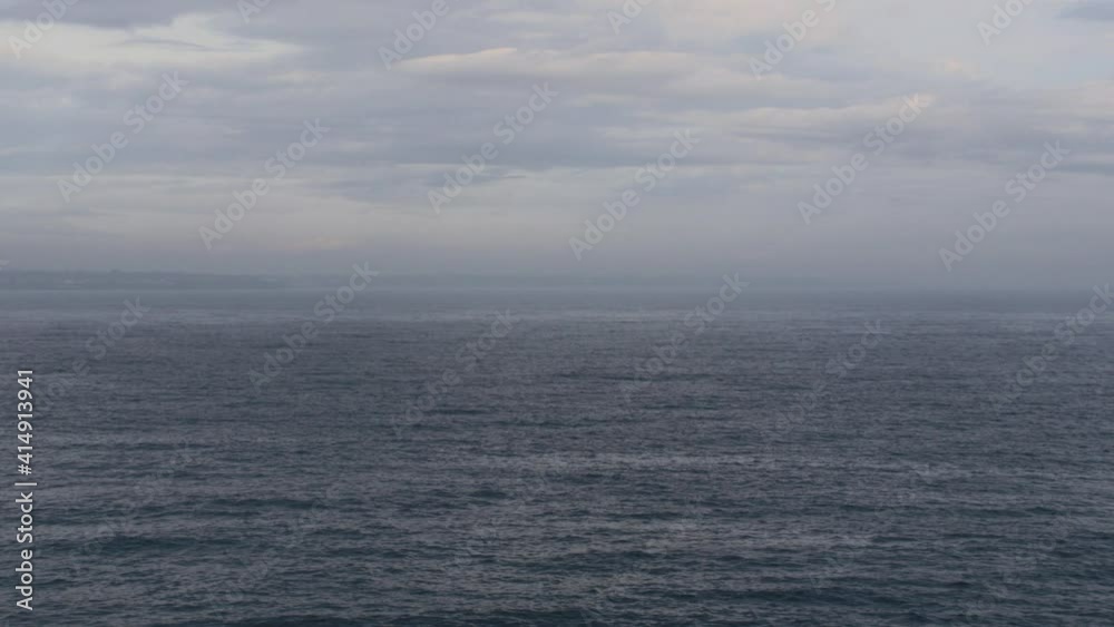 Misty view across calm and empty ocean with clouds. Mindfulness peace concept Misty view across calm and empty ocean with clouds. Mindfulness peace concept