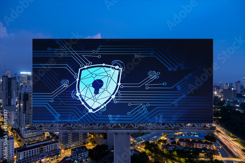 Canvas Print Padlock icon hologram on road billboard over panorama city view of Kuala Lumpur at night to protect business, Malaysia, Asia