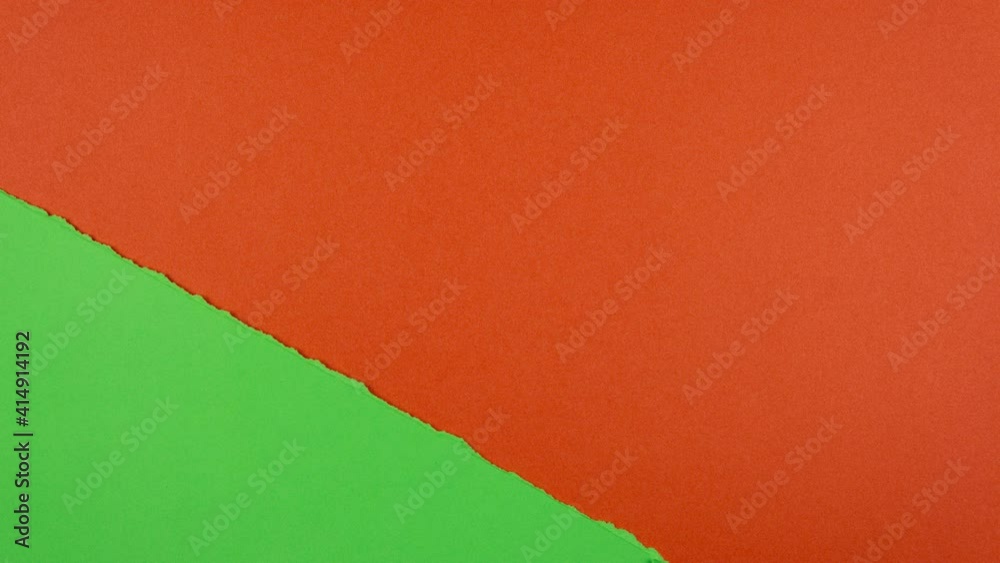 Stop motion animation. Green paper tear and reveal red background. Space for text