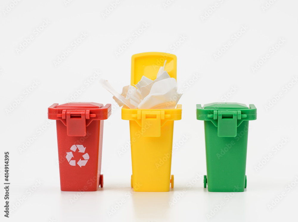 three multi-colored plastic containers on a white background three multi-colored plastic containers on a white background