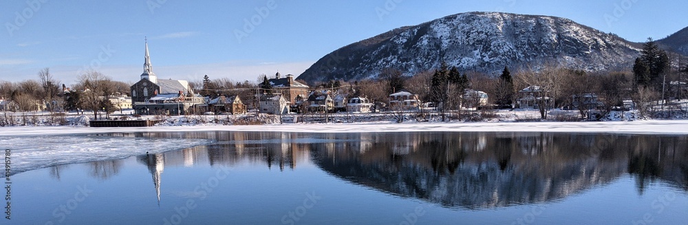 Naklejka premium Reflection of Mont St Hilaire on Richelieu River