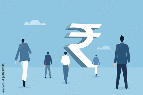 Business people walking towards a big Indian rupee structure 