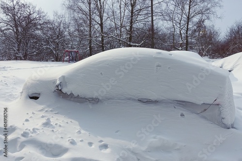 Cars covered in snow on a winter day © Dmitro