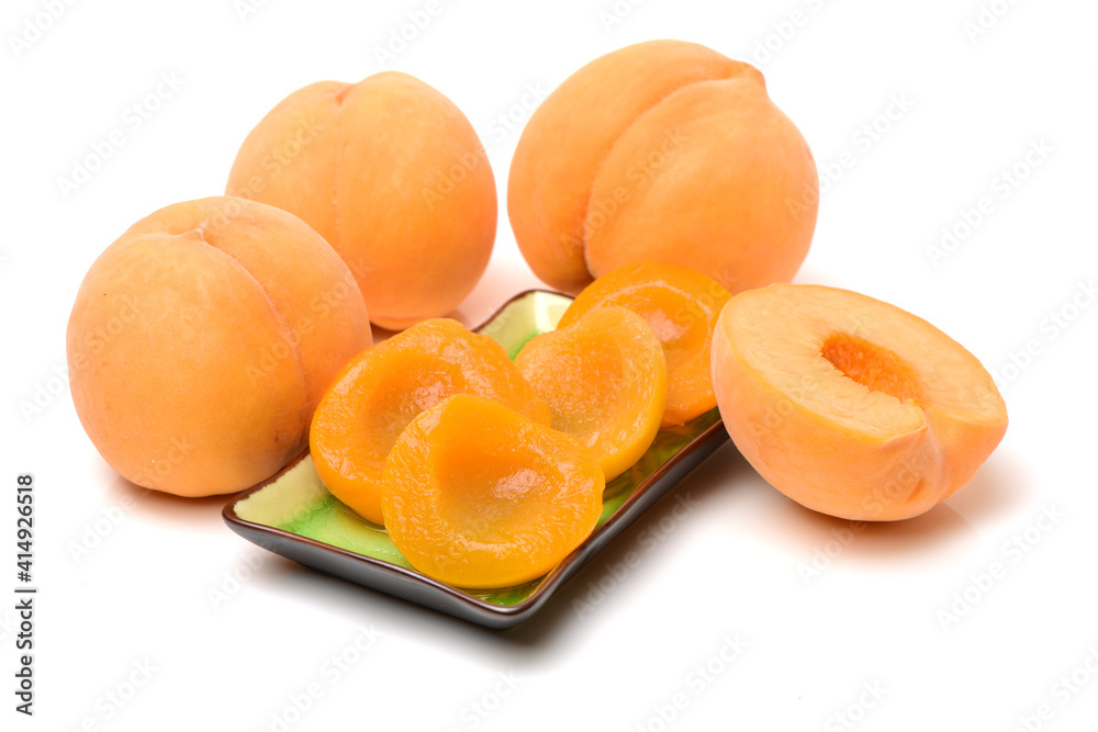 peaches in syrup on a white background 