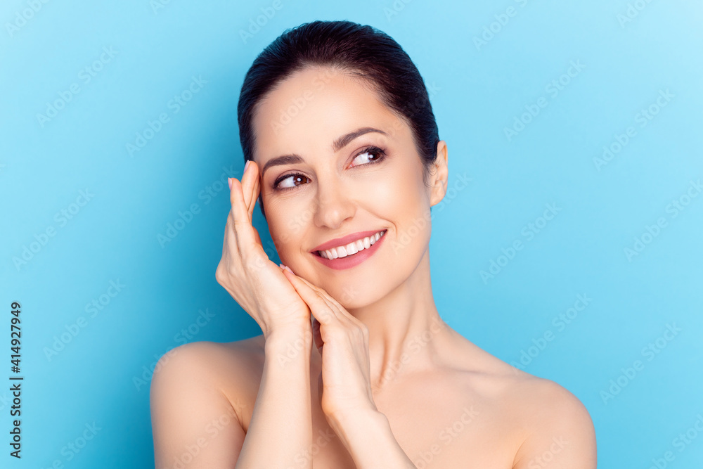 Photo of young cheerful woman happy positive smile enjoy spa therapy isolated over blue color background Photo of young cheerful woman happy positive smile enjoy spa therapy isolated over blue color background