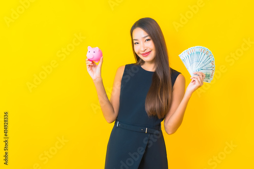 Portrait beautiful young asian business woman with a lot of cash and money
