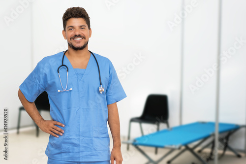 Laughing hispanic doctor at vaccination station