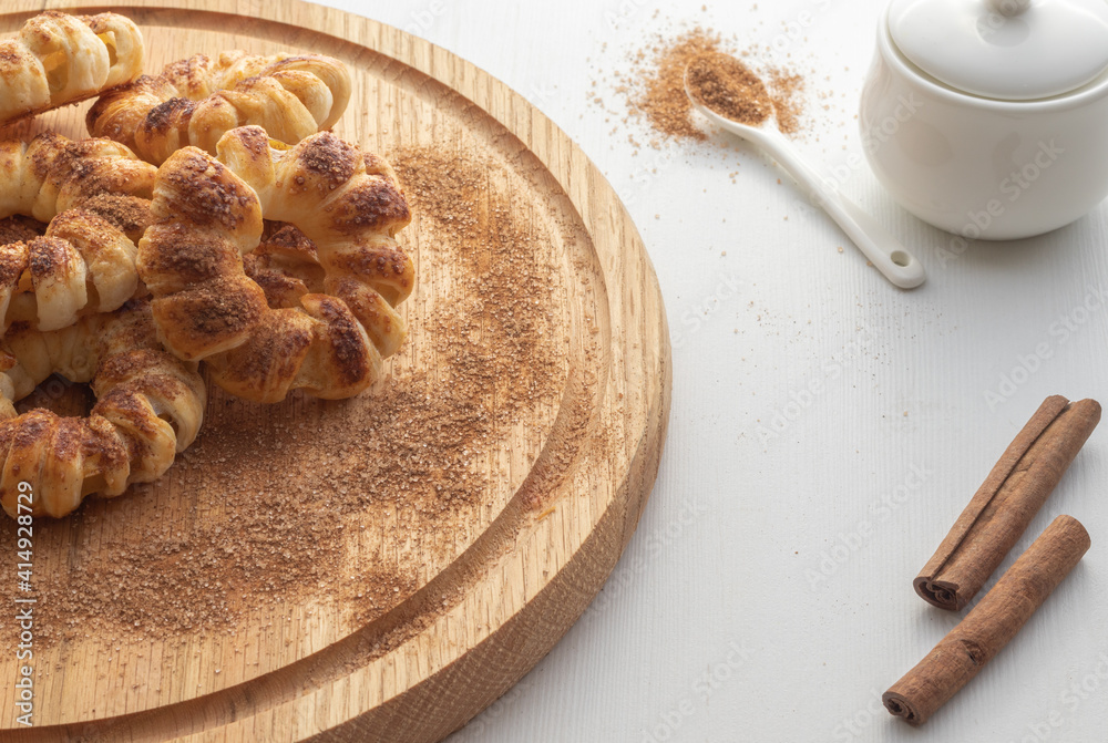 Fototapeta premium Tasty fresh baked cookies on wooden plate. Close up view. Cooking concept.