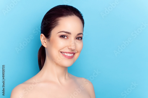 Photo of young woman happy positive smile perfect silky skin spa cream isolated over blue color background