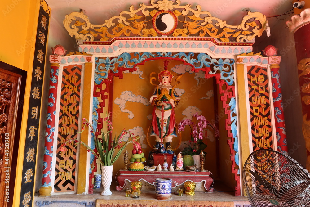 Hoi An, Vietnam, February 18, 2021: Colorful altar at the entrance of the Phap Bao Temple. Hoi An, Vietnam