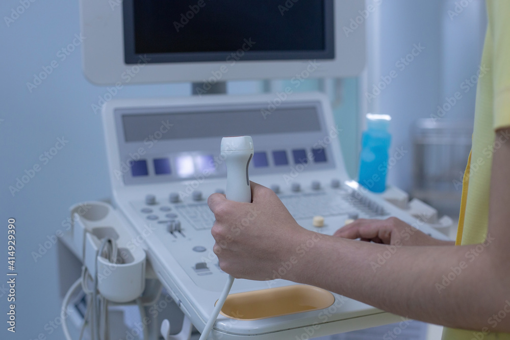 Hands of doctor working at the ultrasound device, Echocardiography. Hands of doctor working at the ultrasound device, Echocardiography.