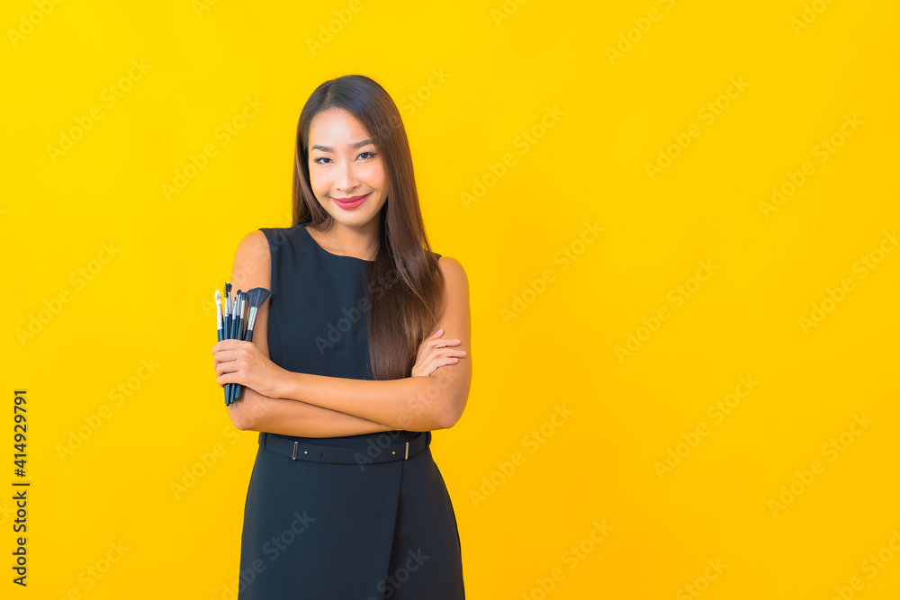 Portrait beautiful young asian business woman with make up brush Portrait beautiful young asian business woman with make up brush