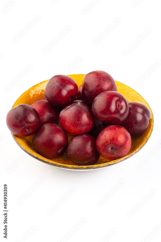 Red round plum on white background Red round plum on white background