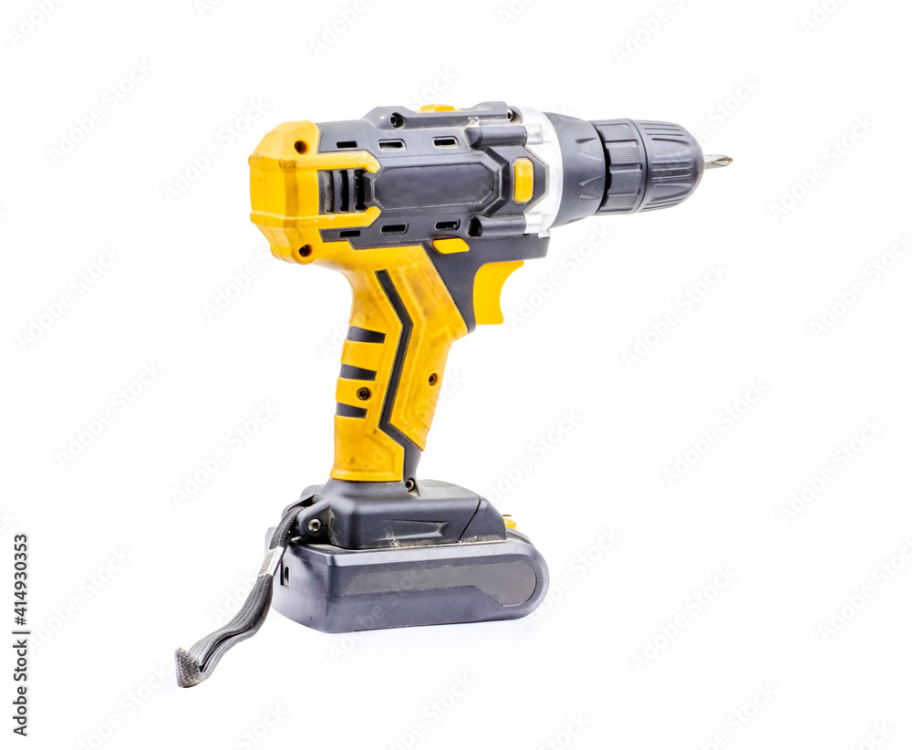 Screwdriver on a white background, Manual black with yellow electric screwdriver on white background, Drill accumulator for charging purposes in a yellow colour
