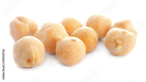 Dried chickpea beans isolated on white background, close-up. Macro photo of dried chickpeas isolated on white background. Dry grains of chickpea isolated on white background. Dry garbanzo close up.