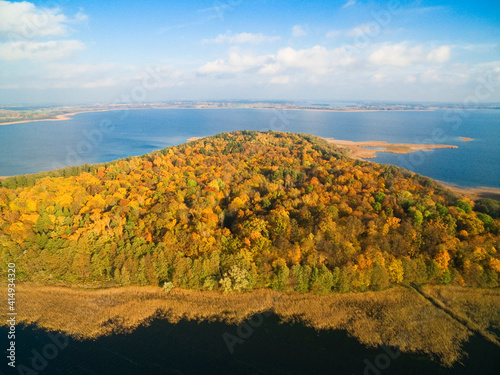 Colorful autumn view of Mamry Lake and Upalty island - the biggest Masurian island, Mazury, Poland
