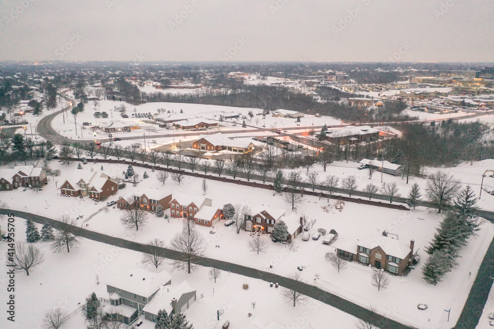 Obraz premium Winter snow storm across the United States covers midwest neighborhoods and homes