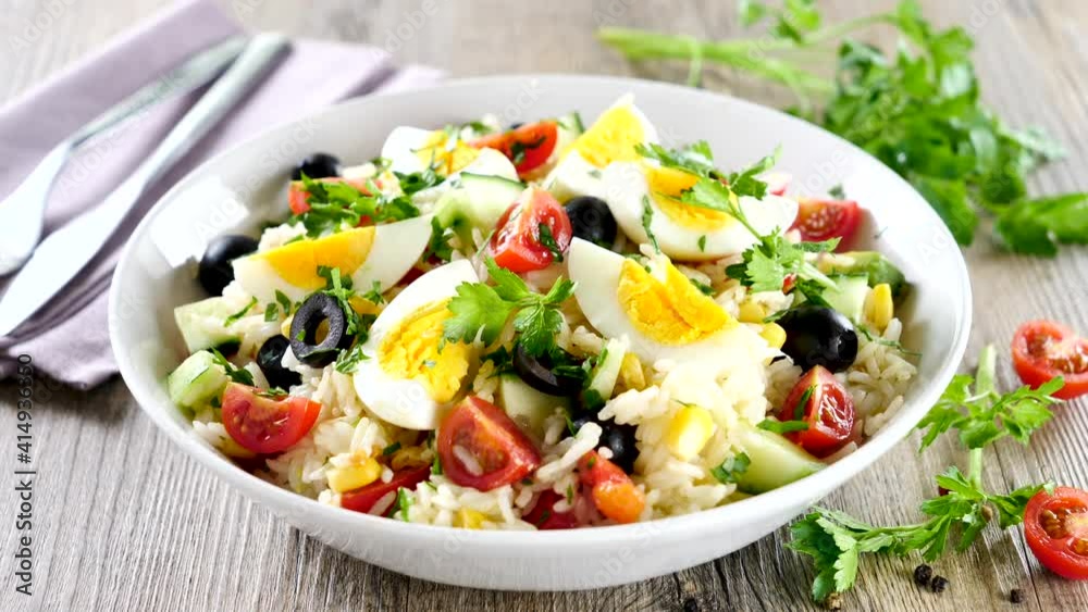 vegetable salad with rice, egg, tomato and olive vegetable salad with rice, egg, tomato and olive
