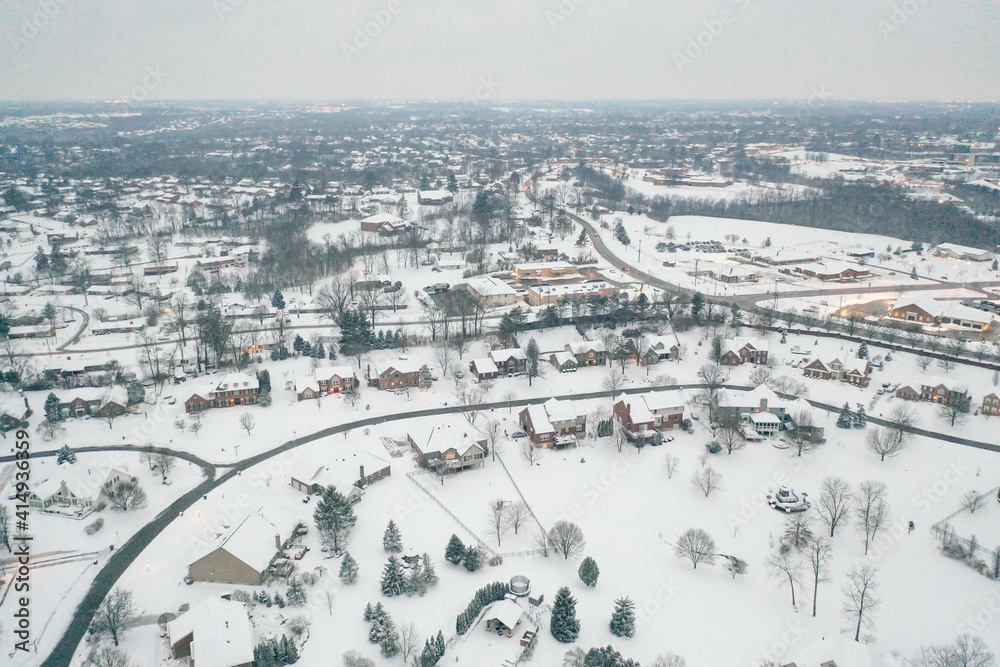 Winter snow storm across the United States covers midwest neighborhoods and homes