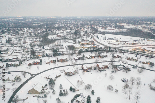 Winter snow storm across the United States covers midwest neighborhoods and homes