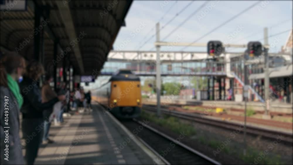 Training pulling into a railway station to stop at the platform Training pulling into a railway station to stop at the platform