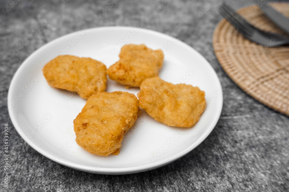 Selective focused Nuggets on white dish. Selective focused Nuggets on white dish.