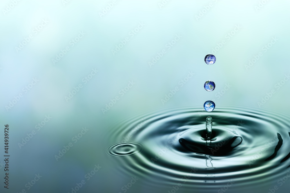 Falling drops of water with blue earth image Falling drops of water with blue earth image