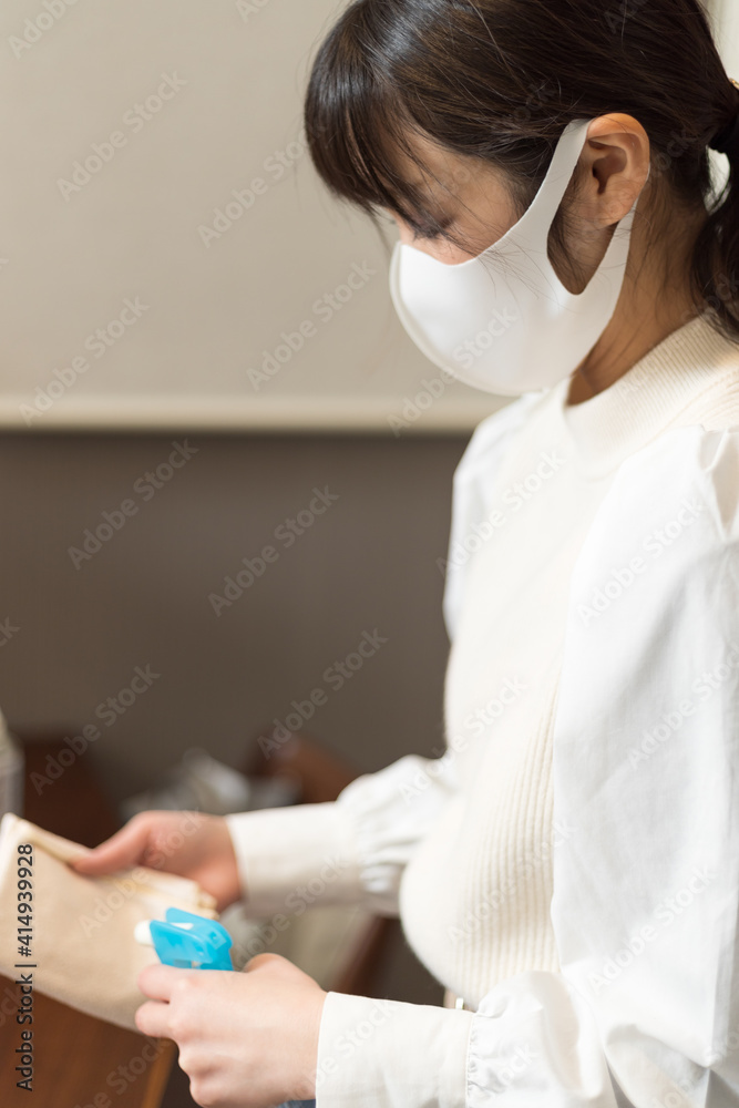 Woman preparing for alcohol disinfection Woman preparing for alcohol disinfection