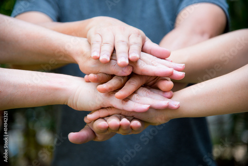 People join hand for teamwork