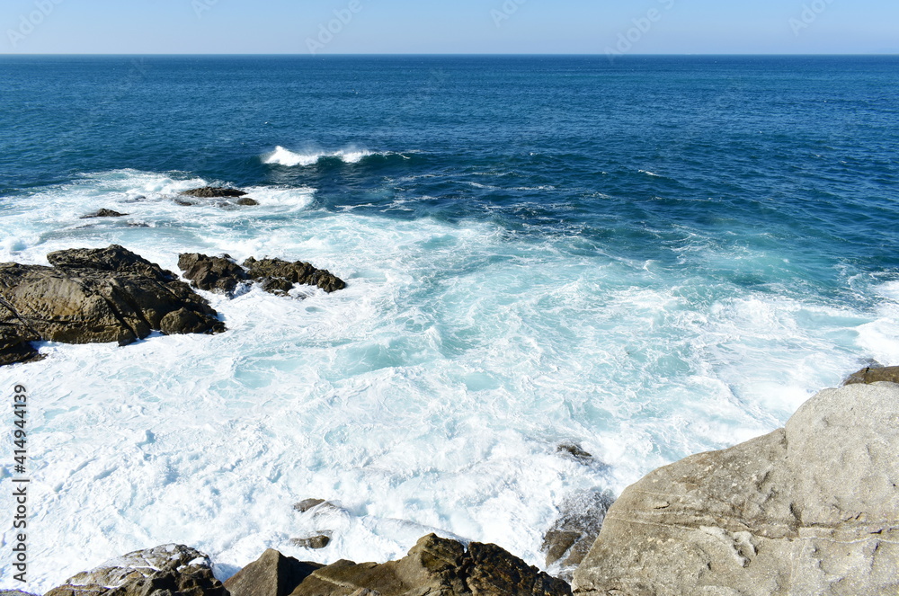 View from a cliff with waves breaking at famous Rias Baixas in Galicia Region. Porto do Son, Coruña, Spain. View from a cliff with waves breaking at famous Rias Baixas in Galicia Region. Porto do Son, Coruña, Spain.
