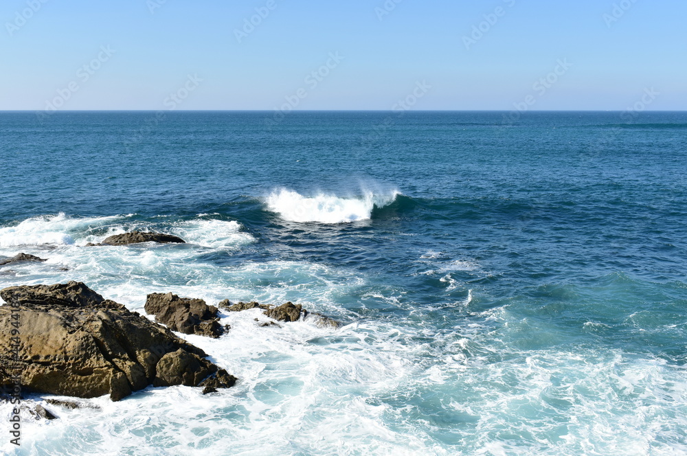 View from a cliff with waves breaking at famous Rias Baixas in Galicia Region. Porto do Son, Coruña, Spain. View from a cliff with waves breaking at famous Rias Baixas in Galicia Region. Porto do Son, Coruña, Spain.