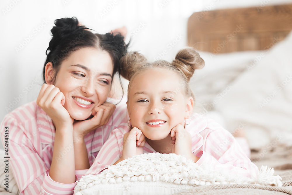 Mother and daughter having fun at home. Girls indoors. Mother and daughter having fun at home. Girls indoors.