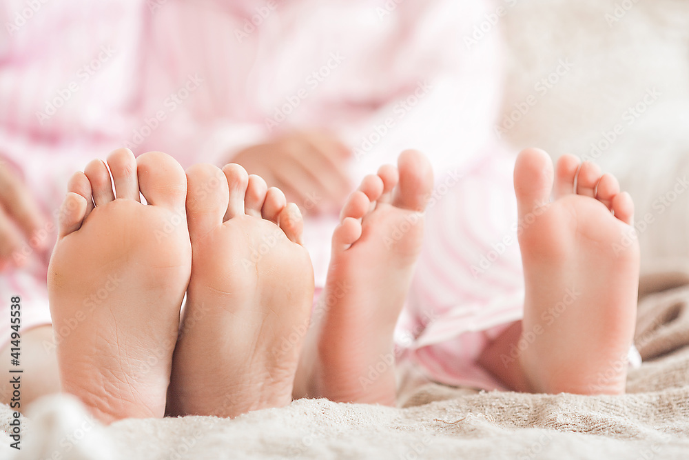 Mother`s and daughter`s feeet closeup still. Mother`s and daughter`s feeet closeup still.