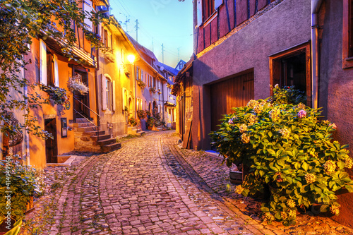 Fototapeta Naklejka Na Ścianę i Meble -  Charming street in the fortified town of Eguisheim, Alsace, France