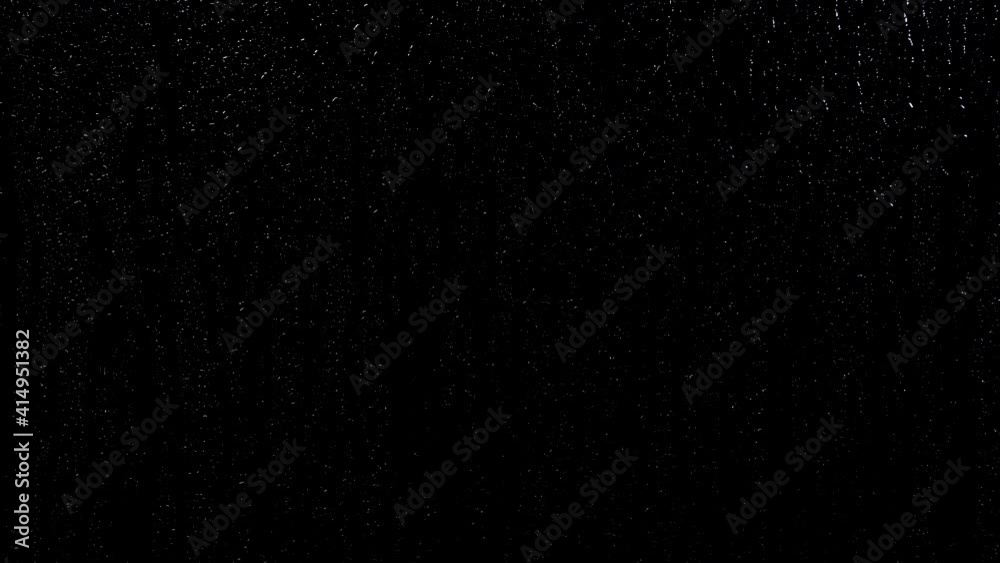 Raindrops on glass and black background Raindrops on glass and black background