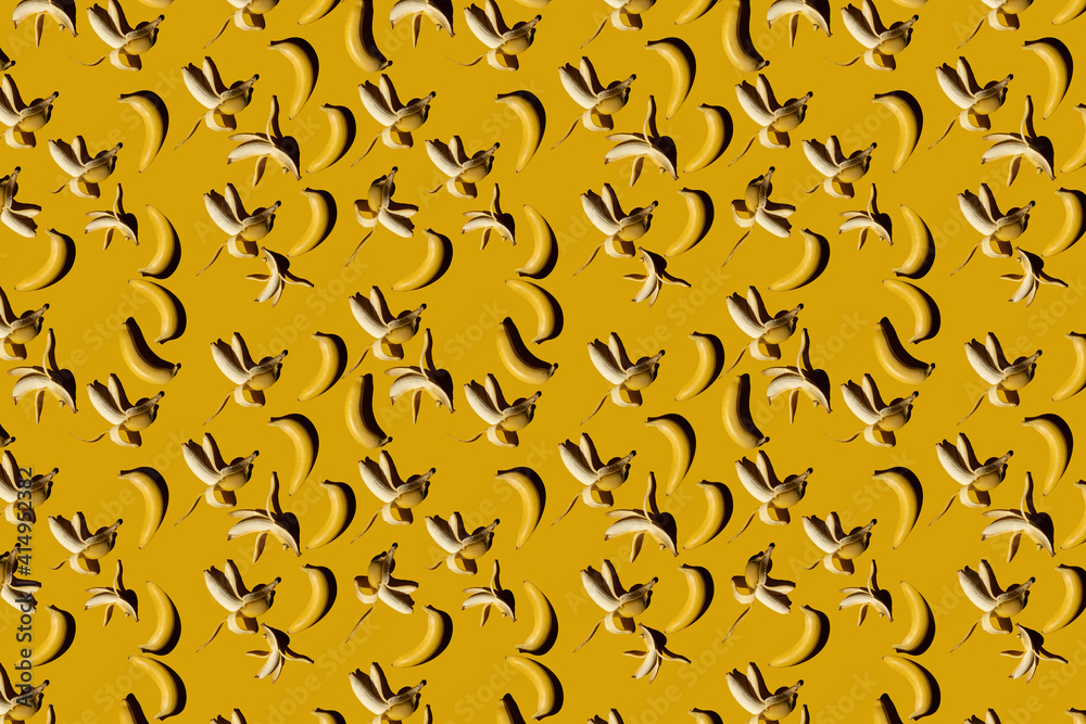 Seamless pattern with banana on yellow background. Abstract banana background. Top view. Flat lay